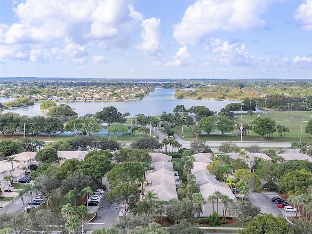birds eye view of property with a water view and a residential view