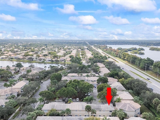 birds eye view of property featuring a residential view and a water view