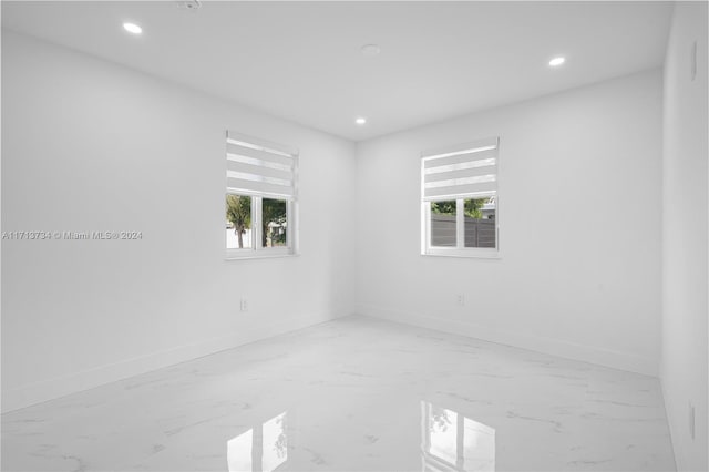 unfurnished room with plenty of natural light