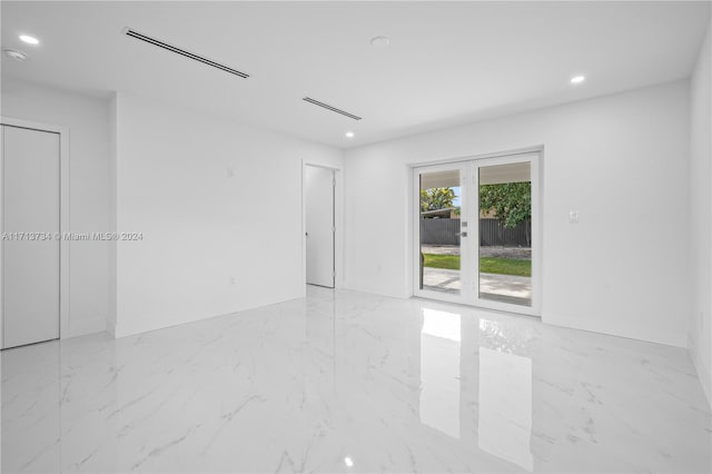 empty room featuring french doors