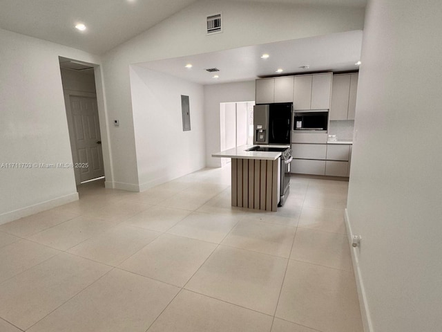 kitchen with visible vents, white cabinets, modern cabinets, appliances with stainless steel finishes, and a center island