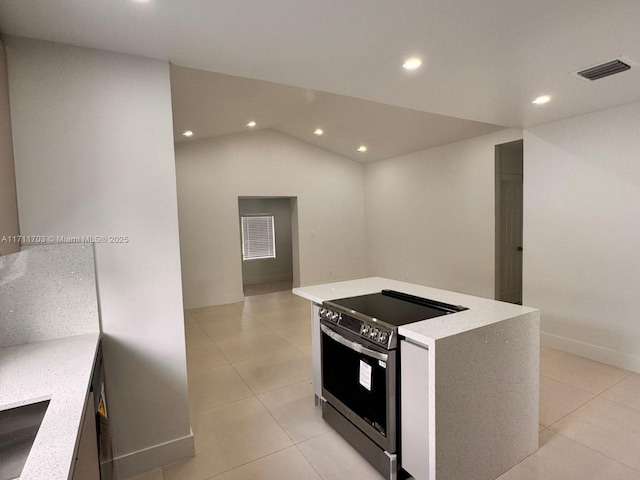 kitchen featuring a center island, light tile patterned floors, recessed lighting, visible vents, and stainless steel range with electric cooktop