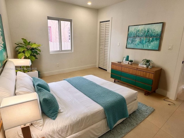 bedroom featuring baseboards and recessed lighting