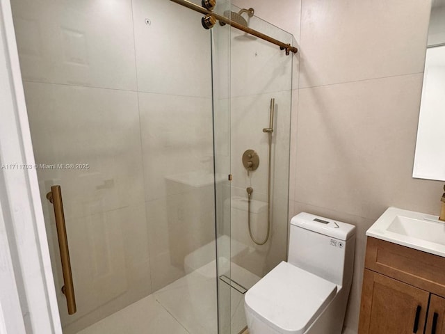 full bath with toilet, a stall shower, tile walls, and vanity