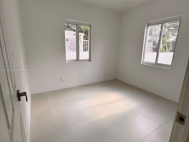 view of tiled spare room