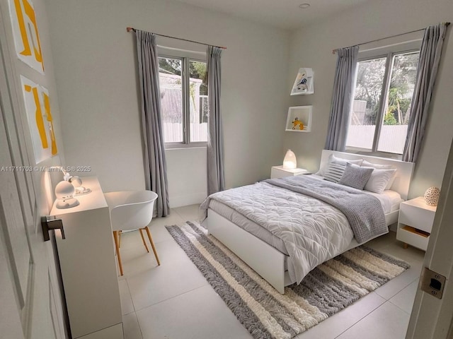 bedroom featuring light tile patterned floors