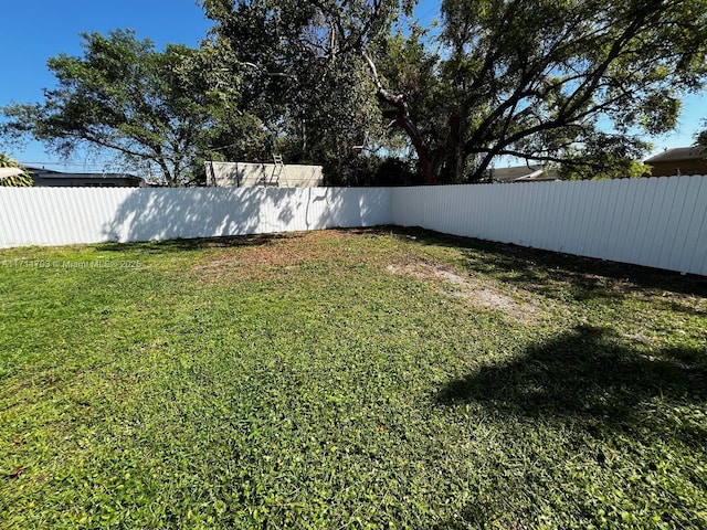 view of yard featuring fence