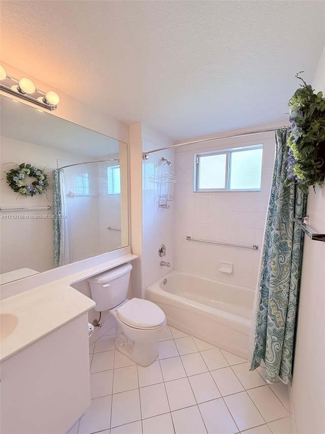 full bathroom featuring vanity, tile patterned floors, a textured ceiling, and toilet