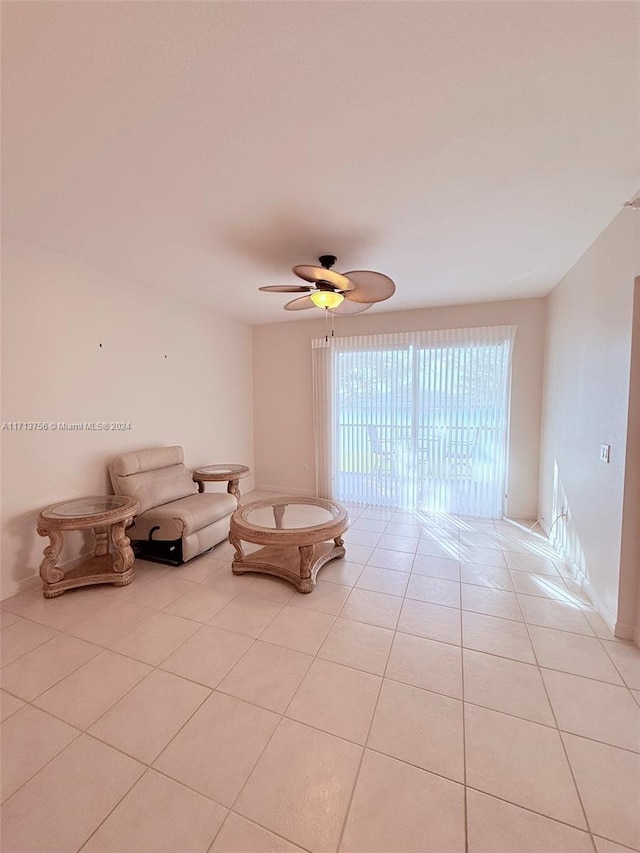 unfurnished room featuring ceiling fan and light tile patterned flooring