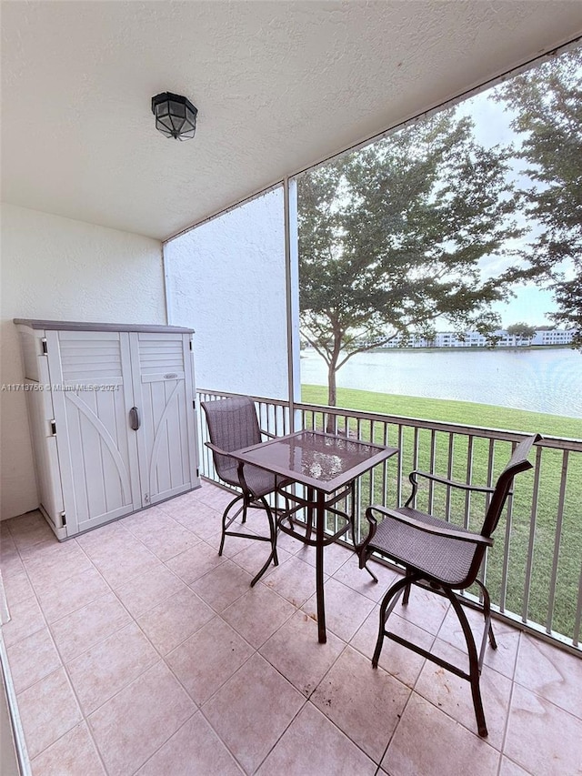 balcony featuring a water view