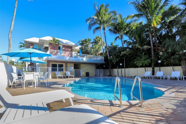 view of swimming pool featuring a patio area