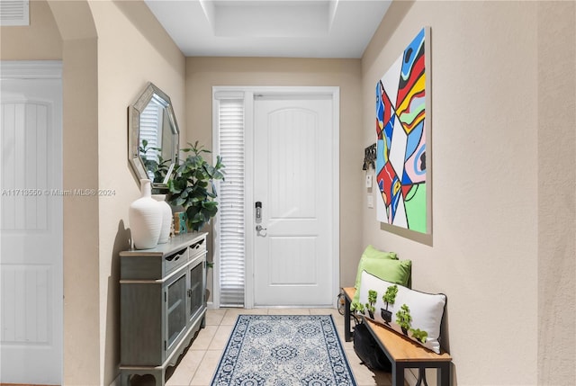 entrance foyer featuring light tile patterned flooring