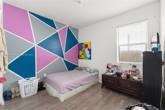 bedroom with wood-type flooring