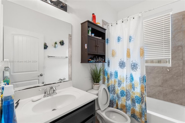 full bathroom featuring vanity, toilet, and shower / tub combo with curtain