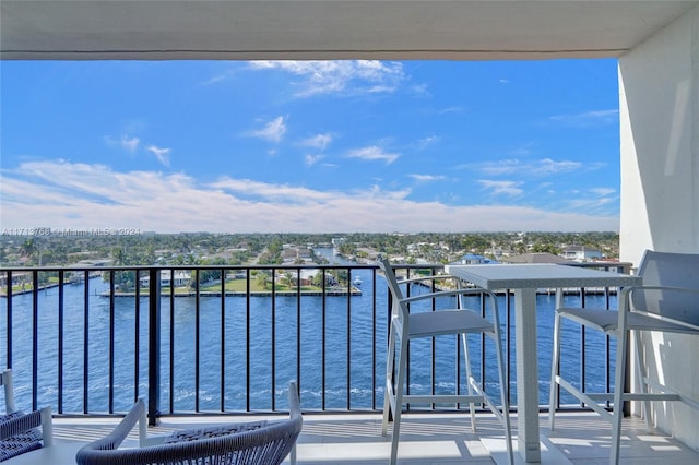 balcony featuring a water view