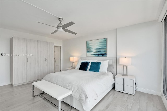 bedroom featuring light wood-type flooring and ceiling fan