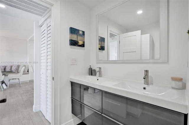 bathroom with wood-type flooring and vanity