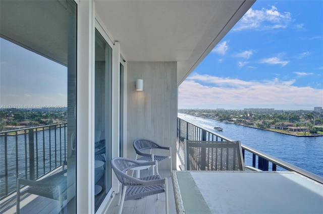 balcony featuring a water view