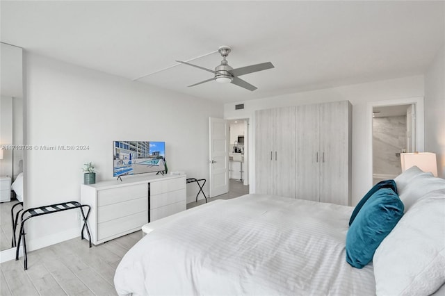 bedroom with light hardwood / wood-style flooring and ceiling fan