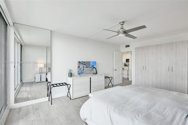 bedroom featuring ceiling fan and light wood-type flooring