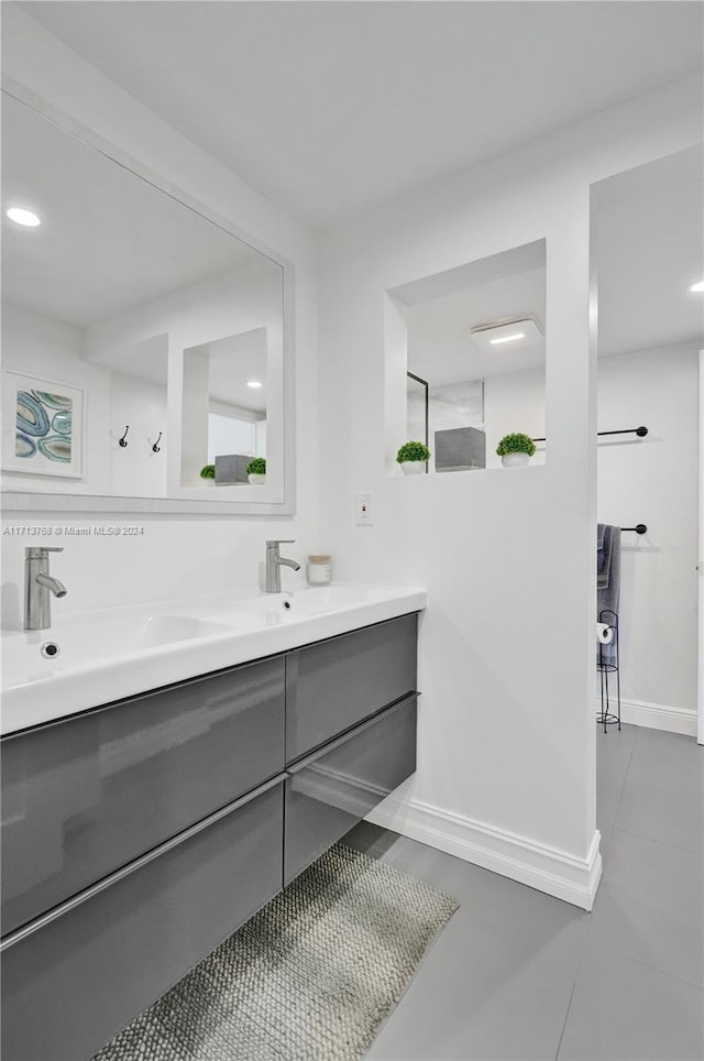 bathroom featuring tile patterned floors and vanity