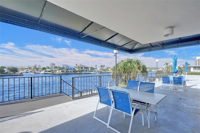 view of patio featuring a water view