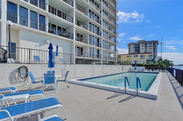 view of swimming pool featuring a patio area