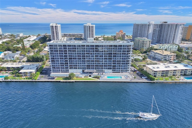 birds eye view of property with a water view