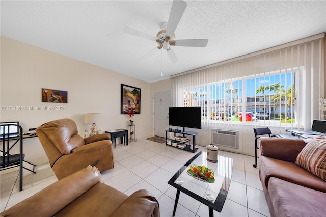 tiled living room featuring a wall mounted air conditioner, a textured ceiling, and ceiling fan