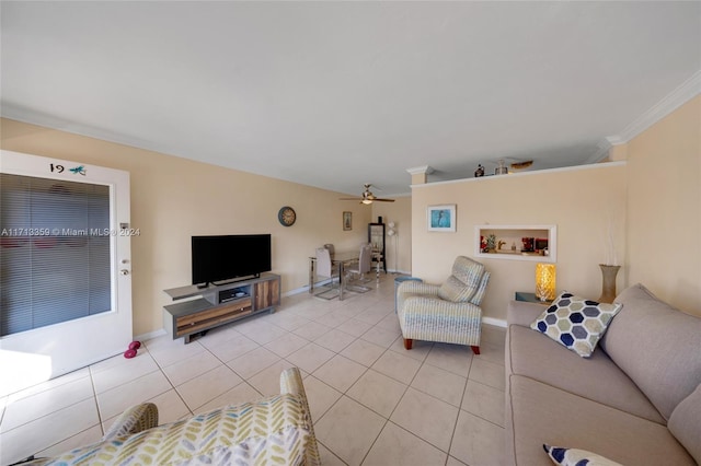 tiled living room featuring ceiling fan and crown molding