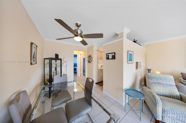 dining room with crown molding, light tile patterned floors, and ceiling fan