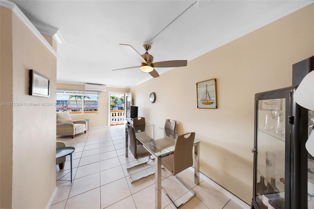 tiled dining area with ceiling fan, ornamental molding, and a wall mounted AC