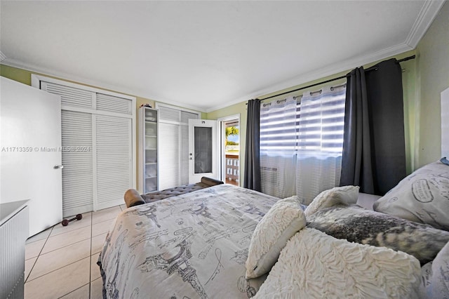 bedroom featuring light tile patterned flooring and crown molding