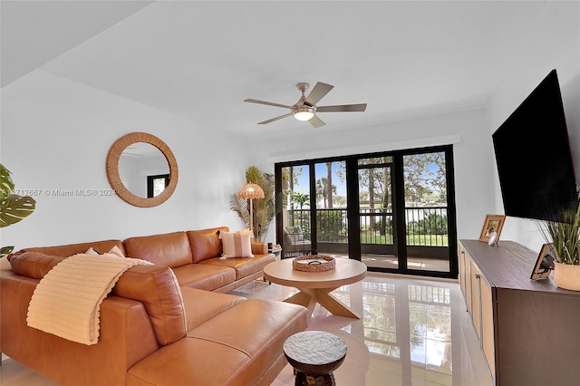 living room featuring ceiling fan and light tile patterned flooring