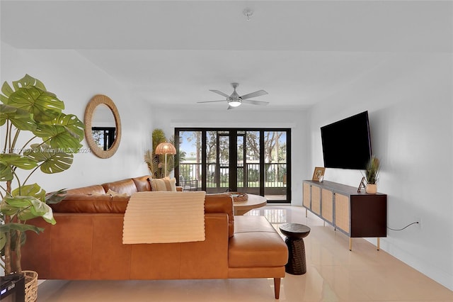 living room with french doors, ceiling fan, and light tile patterned flooring