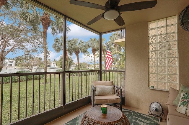 sunroom / solarium with ceiling fan