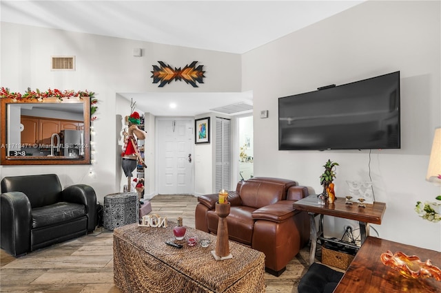 living room with light hardwood / wood-style flooring