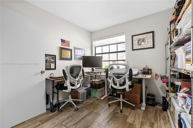 office space with hardwood / wood-style floors