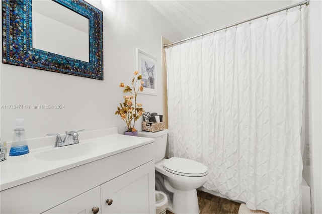 full bathroom featuring vanity, toilet, wood-type flooring, and shower / bath combo