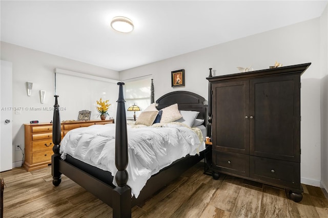 bedroom with wood-type flooring