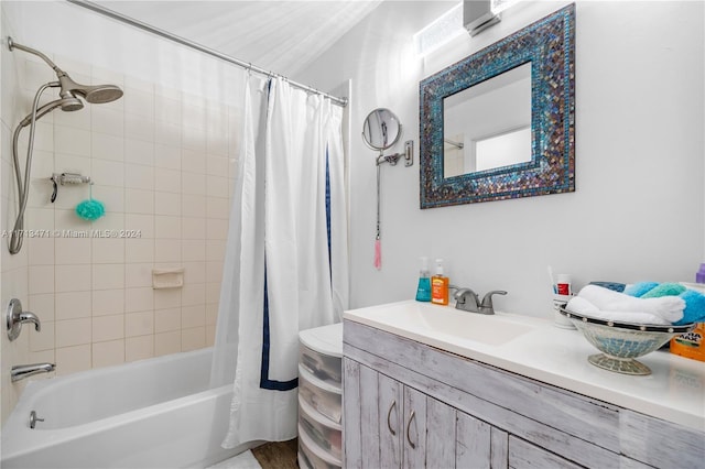 full bathroom featuring vanity, shower / bath combo, and toilet