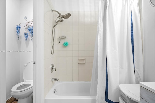 bathroom featuring shower / bath combo and toilet