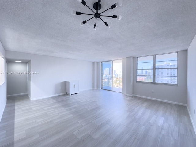 empty room featuring a textured ceiling