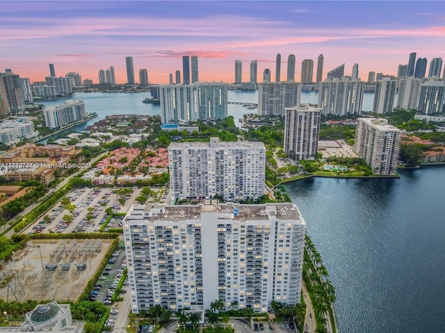 aerial view at dusk with a water view