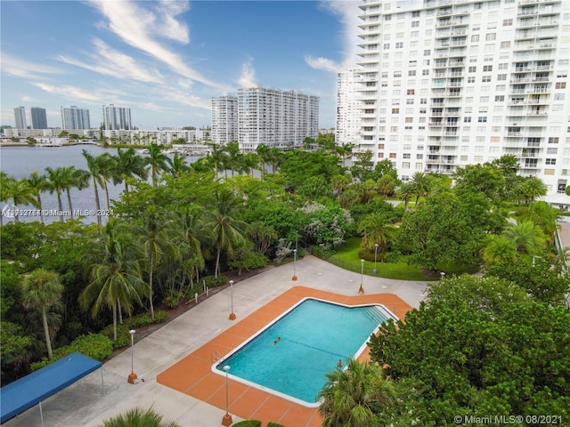 view of pool with a water view