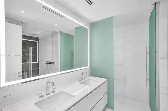 bathroom with vanity and an enclosed shower