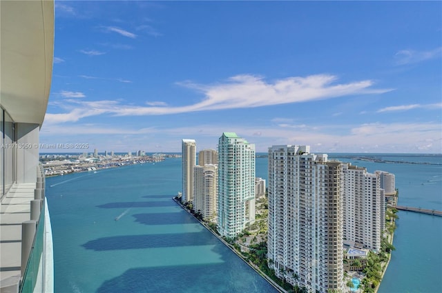 balcony featuring a water view