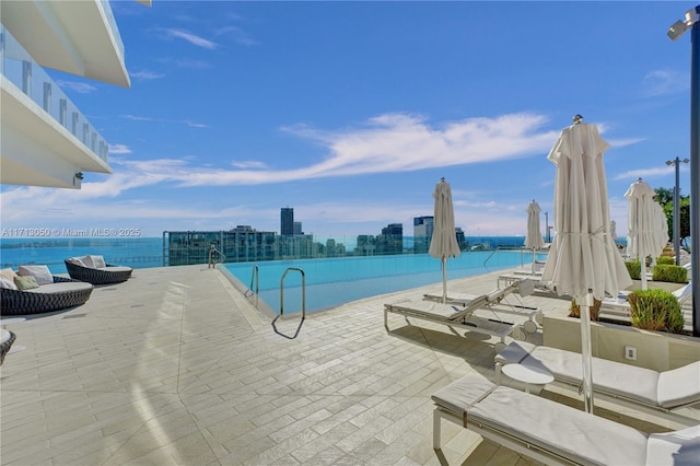 view of pool featuring a water view