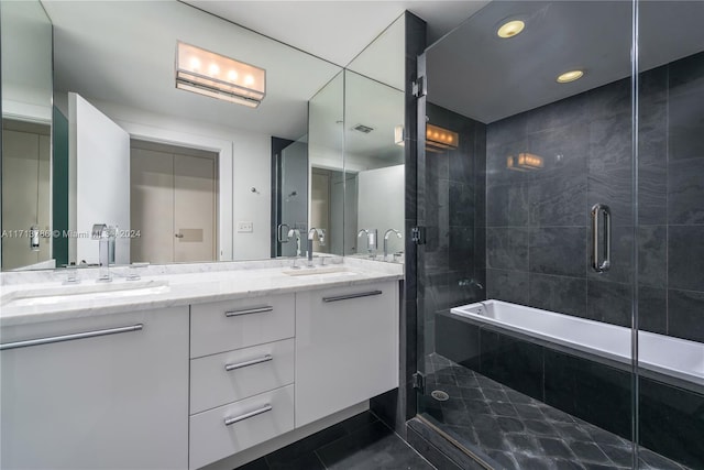 bathroom with tile patterned flooring, vanity, and independent shower and bath