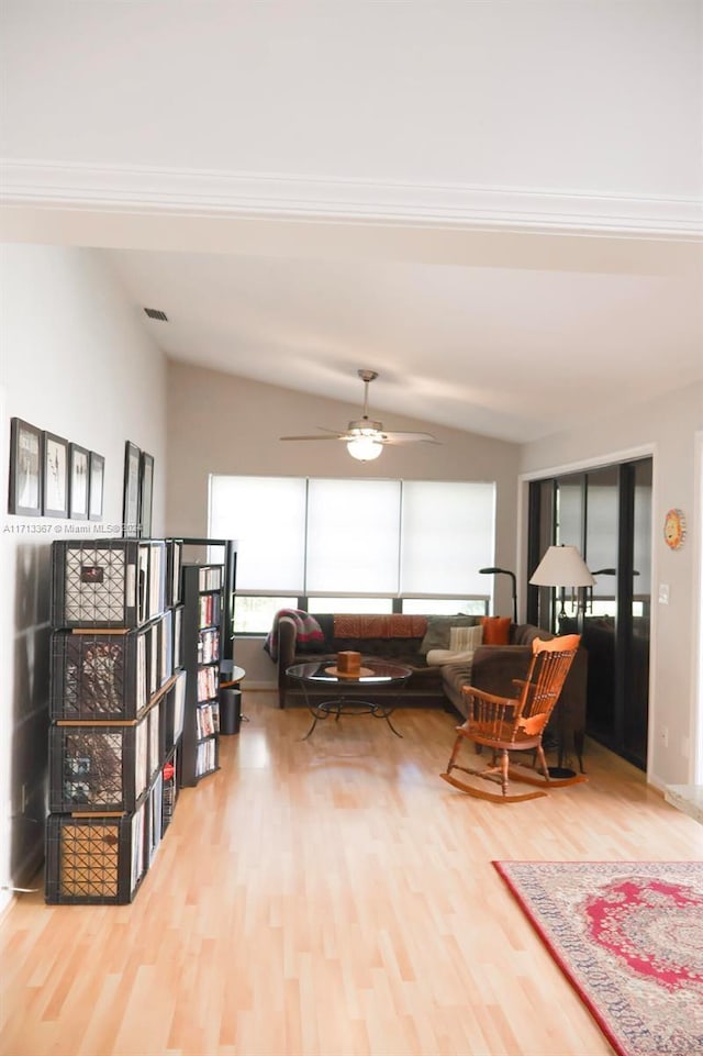 interior space featuring ceiling fan, hardwood / wood-style floors, and vaulted ceiling